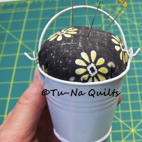 The Pincushion Pail is 2.25" tall and 2" wide at the top.